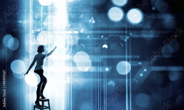 Fototapeta Businesswoman touching icon on screen