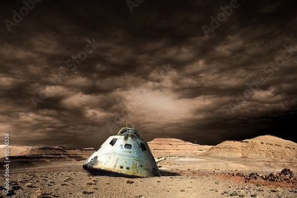 Fototapeta A scorched space capsule lies abandoned on a barren world. - Elements of this image furnished by NASA
