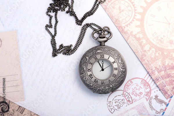 Fototapeta Old clock on a chain. Vintage card