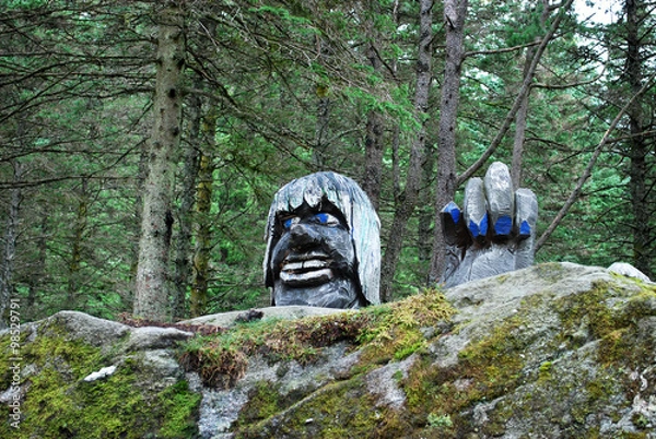 Obraz Troll Figure / wooden troll statue behind the rock in Bergen park, Norway