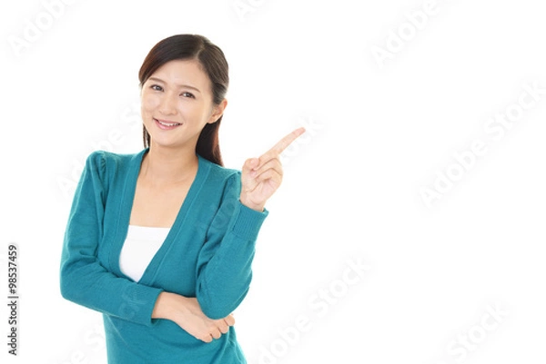 Fototapeta 指示する笑顔の女性