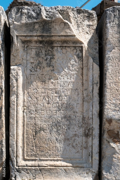 Fototapeta View of ruins surrounding the Library of Celsius from the Marble Street in ancient Ephesus Turkey