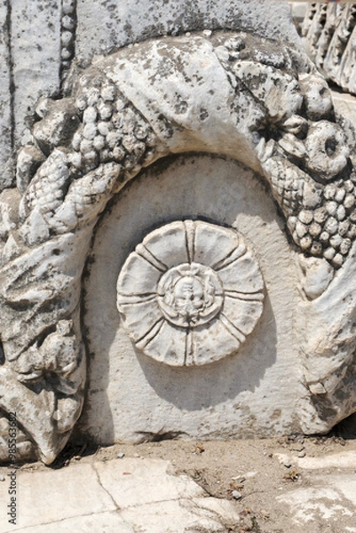 Fototapeta View of ruins surrounding the Library of Celsius from the Marble Street in ancient Ephesus Turkey