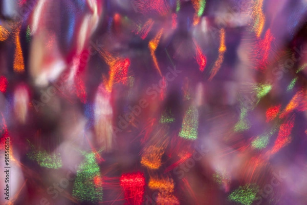 Obraz Abstract colorful background. Defocused blurred lights behind a glass surface