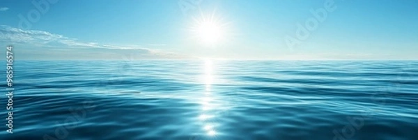 Fototapeta Tranquil ocean scene with a deep blue sky and sparkling water reflecting the summer sun. The image evokes serenity, peace, and a sense of endless blue horizon.