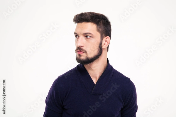 Fototapeta Potrait of attractive thoughtful young man with beard in sweetshirt