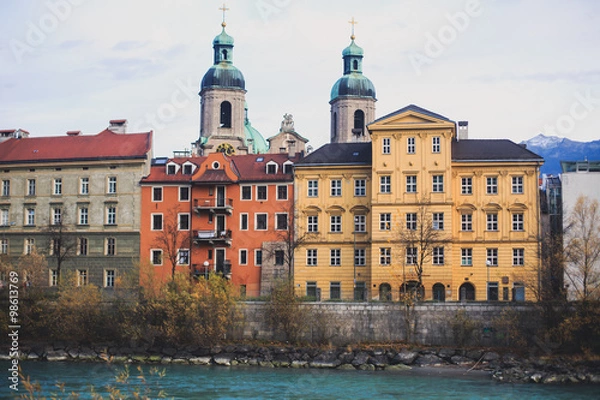 Fototapeta Beautiful super wide-angle aerial view of Innsbruck, Austria with skyline, Alps mountains and scenery beyond the city, and Inn river 