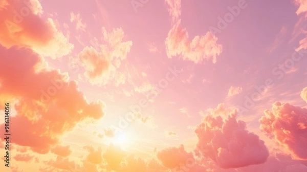 Fototapeta Pastel pink and orange sky during the golden hour, with light clouds scattered across