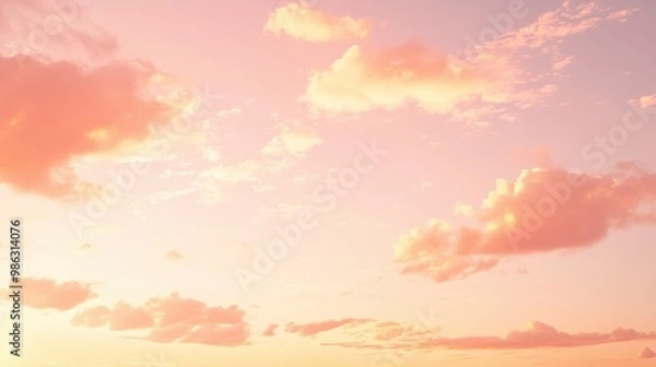Obraz Pastel pink and orange sky during the golden hour, with light clouds scattered across