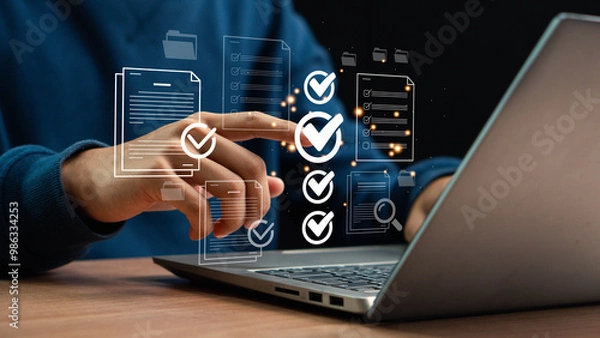 Fototapeta  Businessman Using Tablet and Laptop to Work on Digital Electronic Document. Smart Document Audit Checklist, Standardization, Certification Management, Document Approval, Digital form.