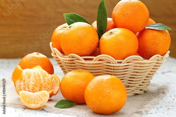 Fototapeta Tangerines in a basket