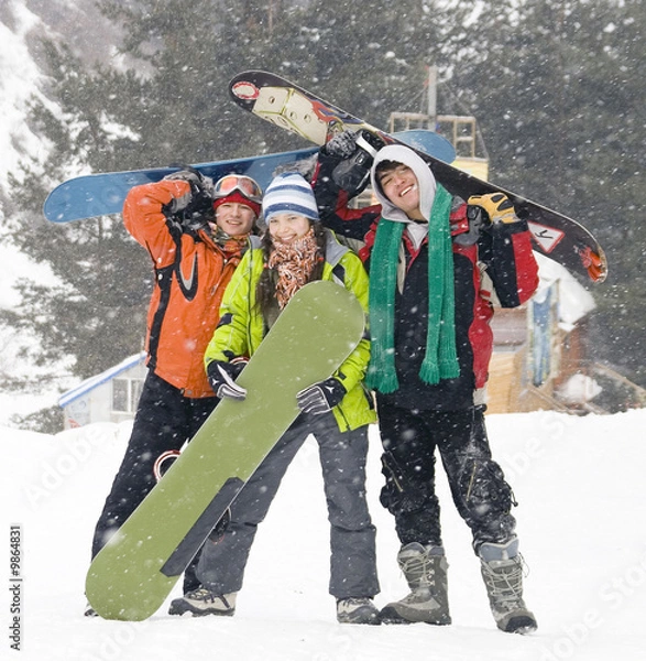 Obraz Happy snowboarding team in winter mountains, health lifestyle