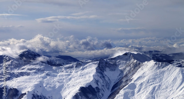 Obraz Panoramic view on winter mountains in clouds