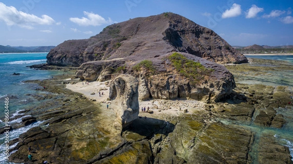 Fototapeta The erosion process of a beach could involve rock weathering or geological processes over a long period of time