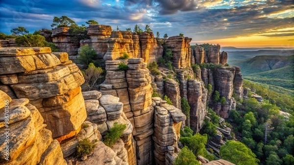 Fototapeta Rugged cliff face with textured rock formations and a distant horizon