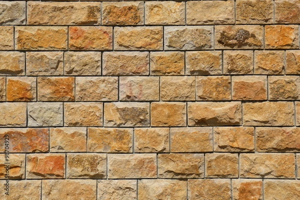 Obraz Masonry from yellow stone blocks