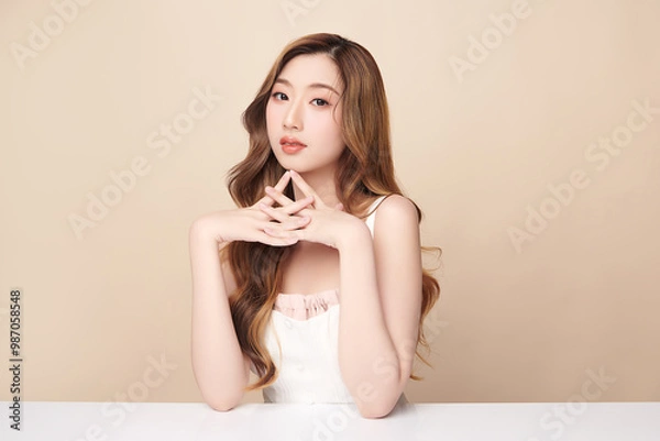 Fototapeta Beautiful young asian woman with clean fresh skin on beige background, Face care, Facial treatment, Cosmetology, beauty and spa, Asian women portrait.