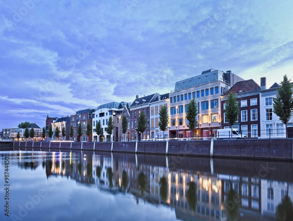 Fototapeta Stately mansions mirrored in a harbor at twilight, Breda, The Netherlands