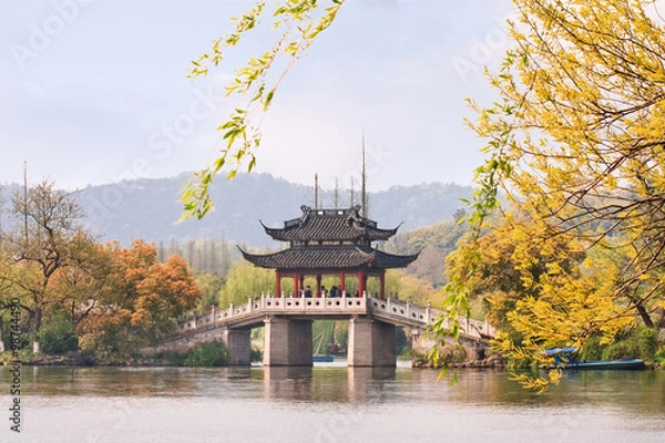 Obraz Famous bridge at enchanting West Lake in autumn colors, Hangzhou, China