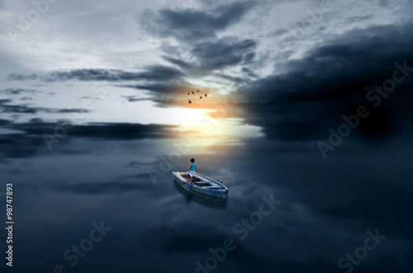 Obraz Journey towards light child in boat in waterscape sea