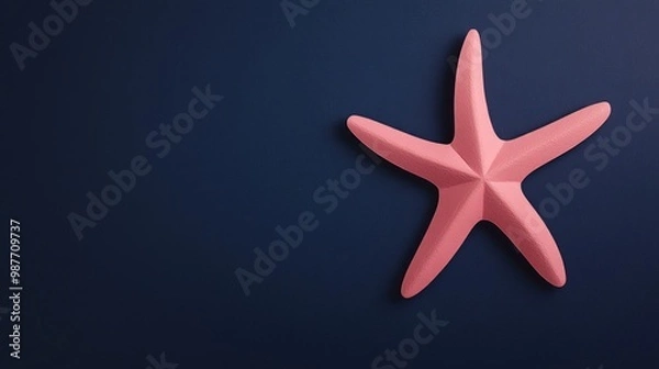 Fototapeta Pink starfish paper cut on dark background fun marine-themed design perfect for children’s books or ocean-themed projects