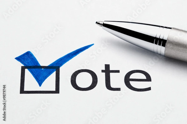 Fototapeta Blue checkmark on vote checkbox, pen lying on ballot paper.