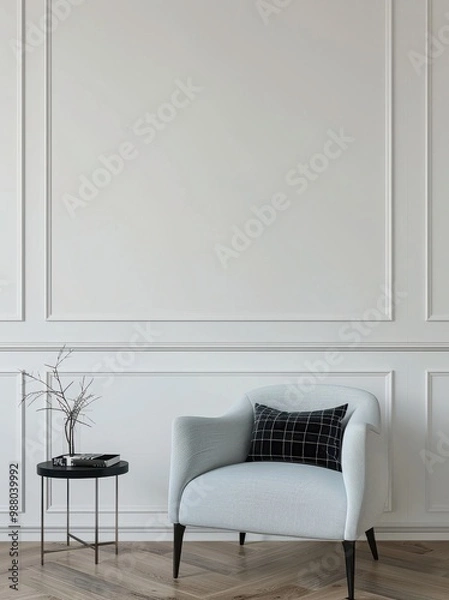 Fototapeta Minimalist interior design with an elegant armchair, cushion, and side table. Classic white wall molding adds a touch of sophistication.
