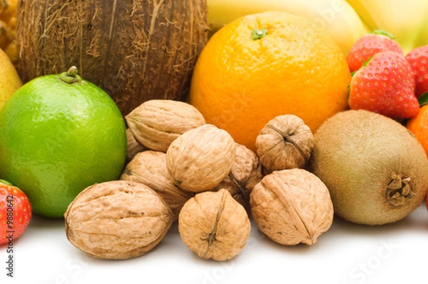 Fototapeta walnuts and fruits on white background