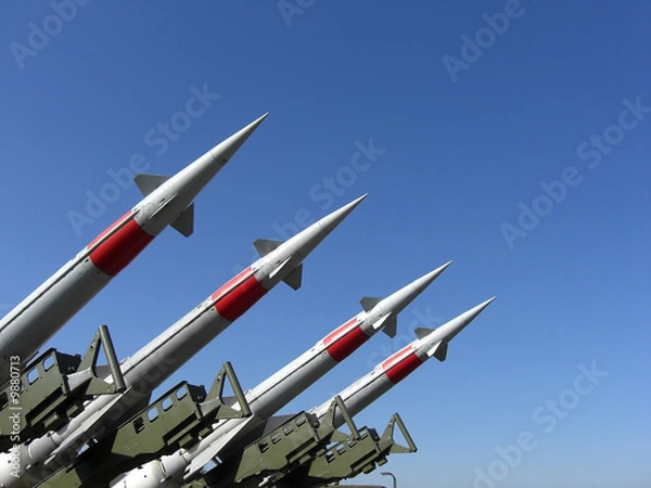 Fototapeta Four missiles against clear blue sky