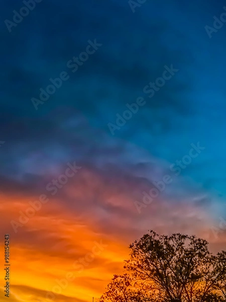 Fototapeta Gradient sunset sunrise sky with copy space, watercolor style edit , bright orange to blue 