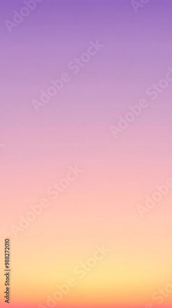 Fototapeta A soft autumn sunset background with pastel oranges and purples blending into a clear evening sky