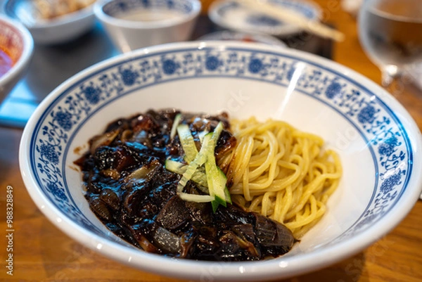Fototapeta Jajangmyeon is a Korean Chinese noodle dish topped with a thick sauce made of chunjang, diced pork, and vegetables.
