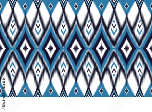 Fototapeta Ikat seamless pattern. Blue white geometric print. Abstract ethnic background. Navy ornament design. Trendy textile texture. Vintage boho wallpaper. Modern chevron style. Zigzag fabric. Ikat decor.