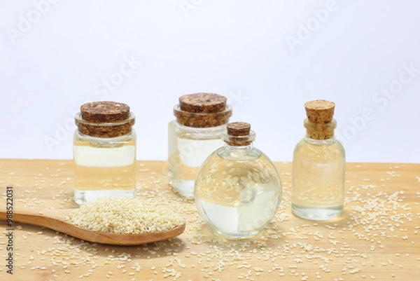 Fototapeta sesame oil in bottles and sesame seeds
