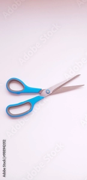 Fototapeta A pair of scissors with a white background