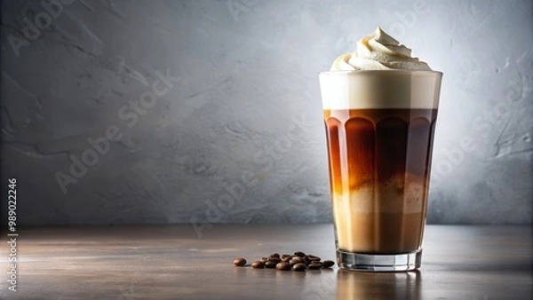 Fototapeta Freshly poured cold brew coffee fills a modern tumbler, topped with a velvety cream and a pinch of dark cocoa, illuminated by soft, warm light on a pristine white background.