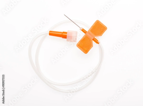 Fototapeta Orange butterfly catheter with open needle isolated on white background. Clipping path included.