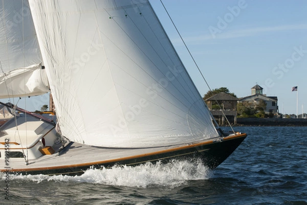 Obraz Adventure sailing as sailboat cuts through the water in Newport Harbor, Rhode Island. Newport is known as the yachting capital of the world.