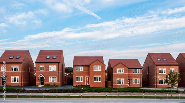Fototapeta A row of new build homes with sold sign