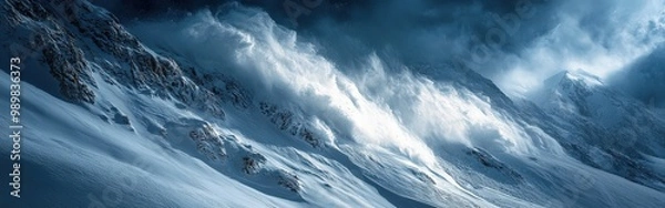 Fototapeta Dramatic snow avalanche rushing down a steep mountain slope