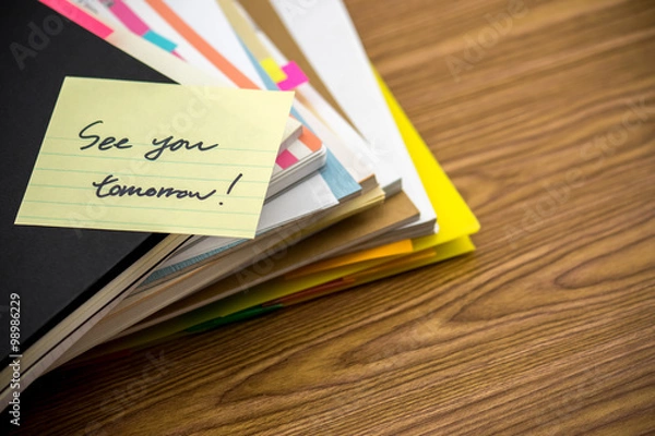 Fototapeta See You Tomorrow; The Pile of Business Documents on the Desk