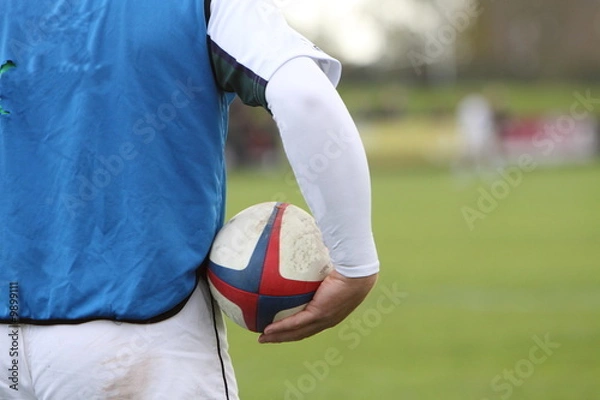 Obraz rugby player holding a ball