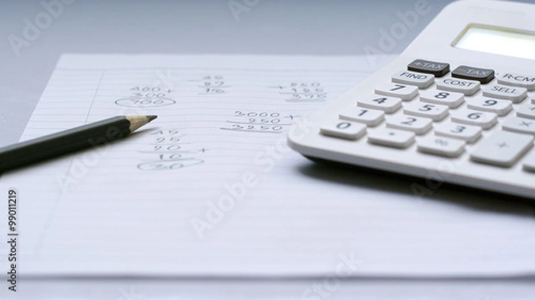 Obraz Calculator and pencil on note paper with calculation concept select focus