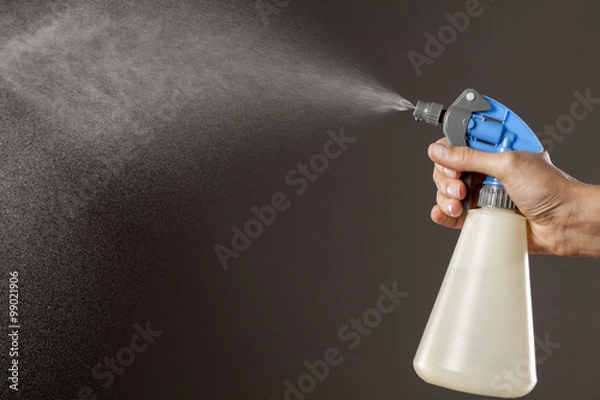 Fototapeta plastic bottle with a sprayer making mist