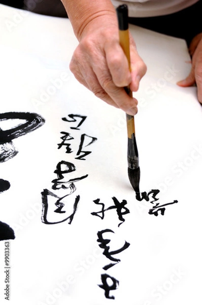 Obraz A old man writing Chinese calligraphy