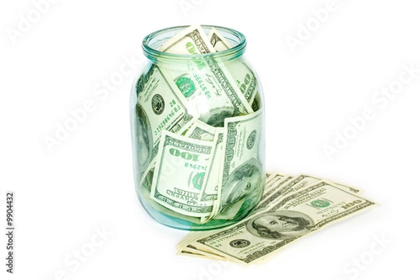 Fototapeta business concept. money in the jar isolated on white