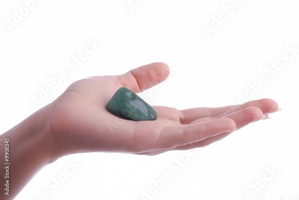 Fototapeta Hand holds aventurine - semiprecious gem