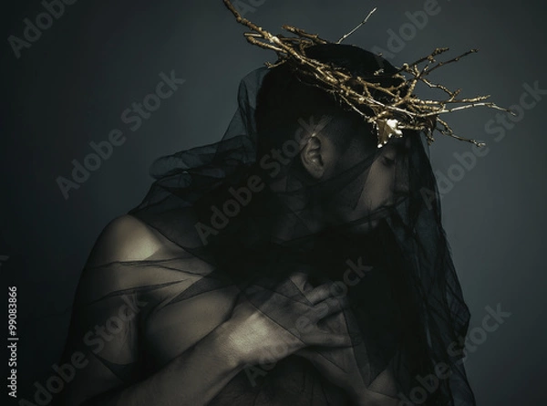 Obraz Portrait of a masculine handsome man in elegant black cloth, with gold crown