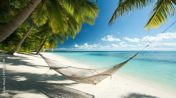 Fototapeta A serene beach scene featuring a hammock strung between palm trees, turquoise waters, and a clear blue sky ideal for relaxation.