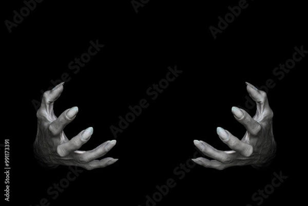 Fototapeta Bony pale male hands of vampire or dead with long fingers and sharp nails, isolated on black. Monster try to hold something, low key, selected focus.